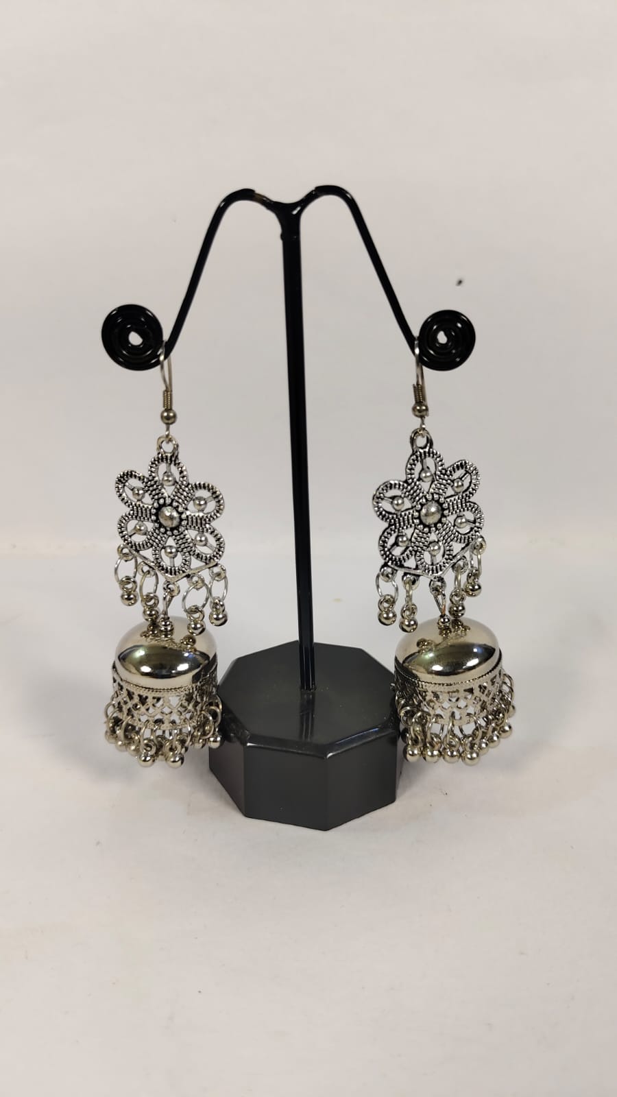 Elegant artificial hanging hoop earrings with intricate floral design and dangling embellishments