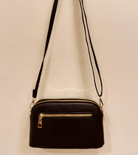 Black crossbody purse with chains featuring front zipper pocket and adjustable strap
