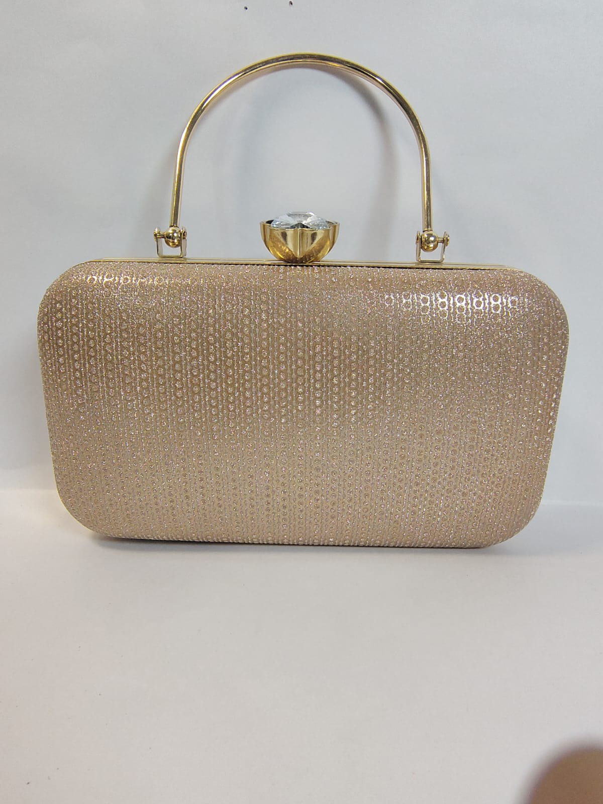 Wincham Fashion House clutch gold bag with a sparkling finish and elegant handle for special occasions