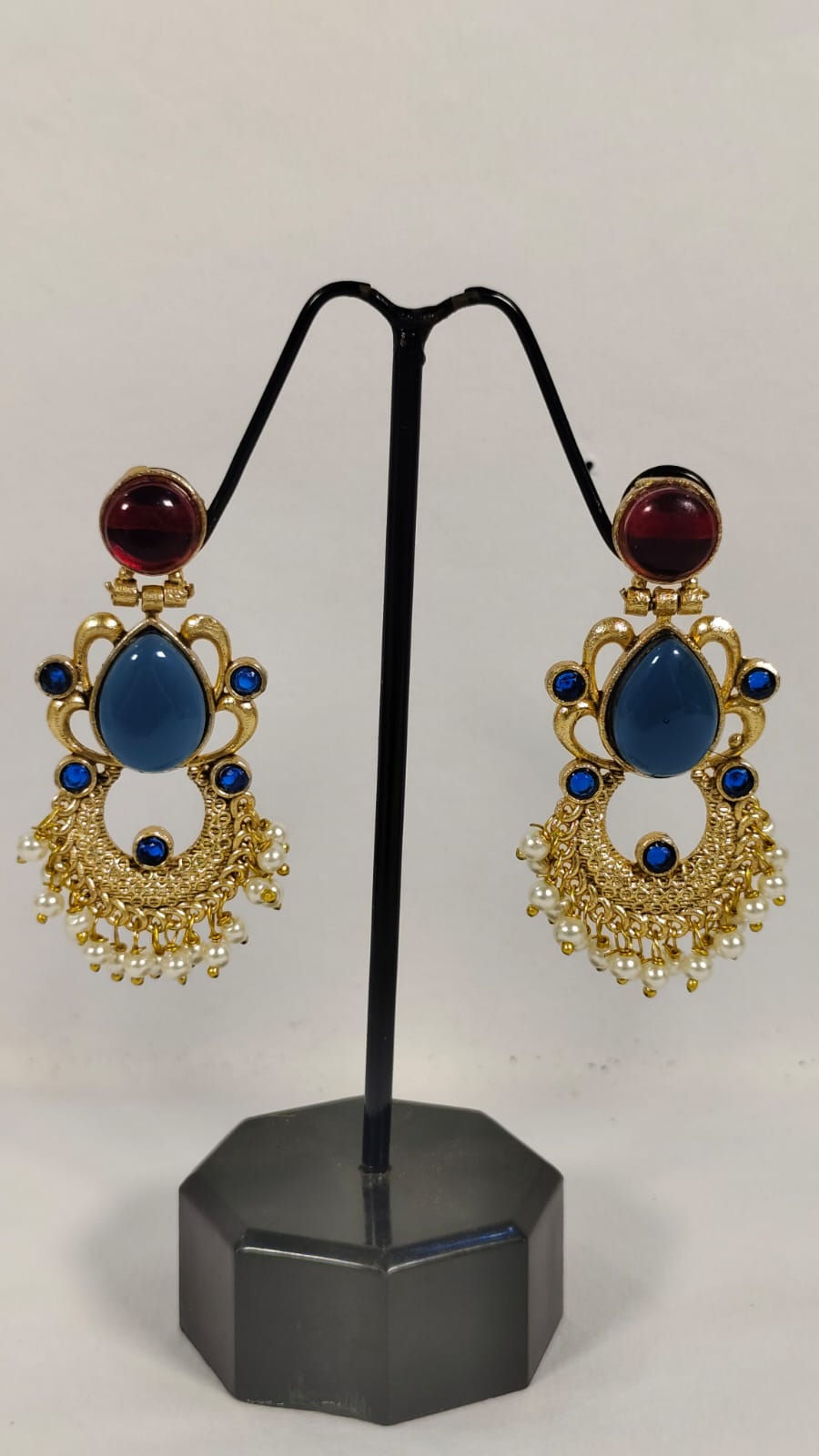 Elegant Wincham Fashion House fancy party wear earrings with blue and red gemstones and intricate gold design