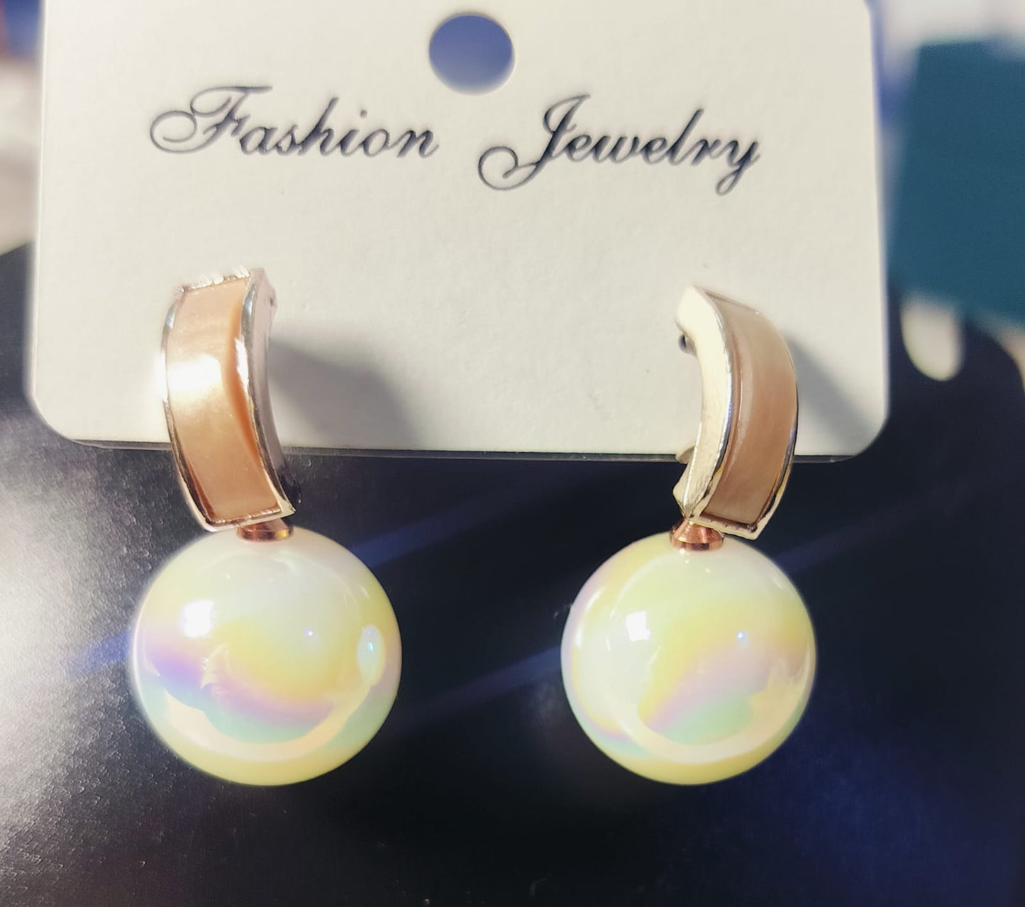 Wincham Fashion House golden pearl earrings with glossy pearl drops and gold-tone metal hooks
