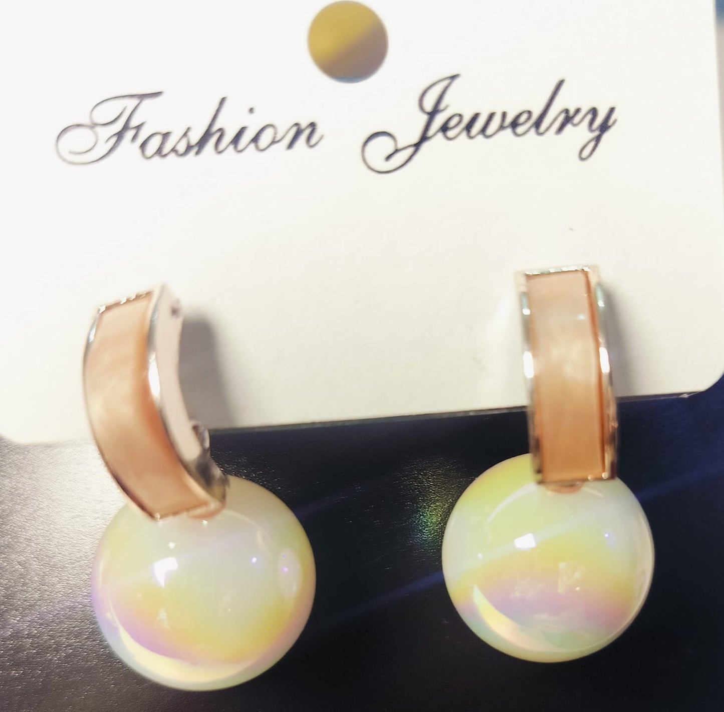 Wincham Fashion House golden pearl earrings with shiny iridescent pearls and gold-tone curved studs