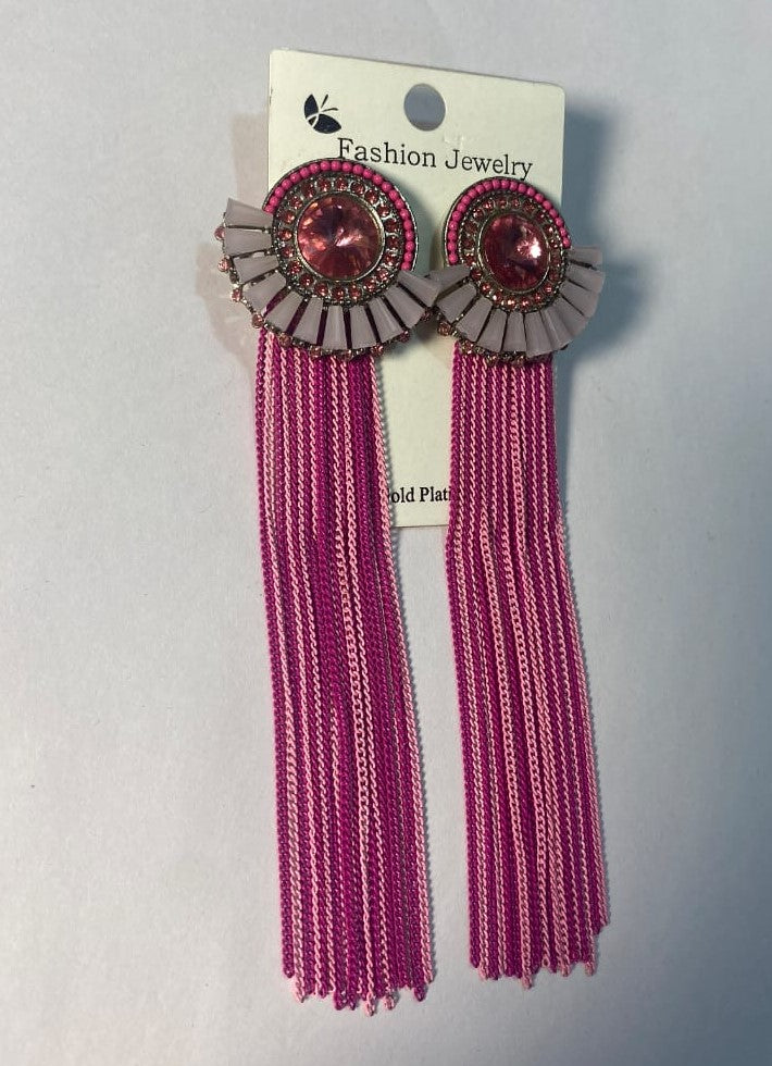 Long pink stone earrings with decorative top and dangling chains on display card