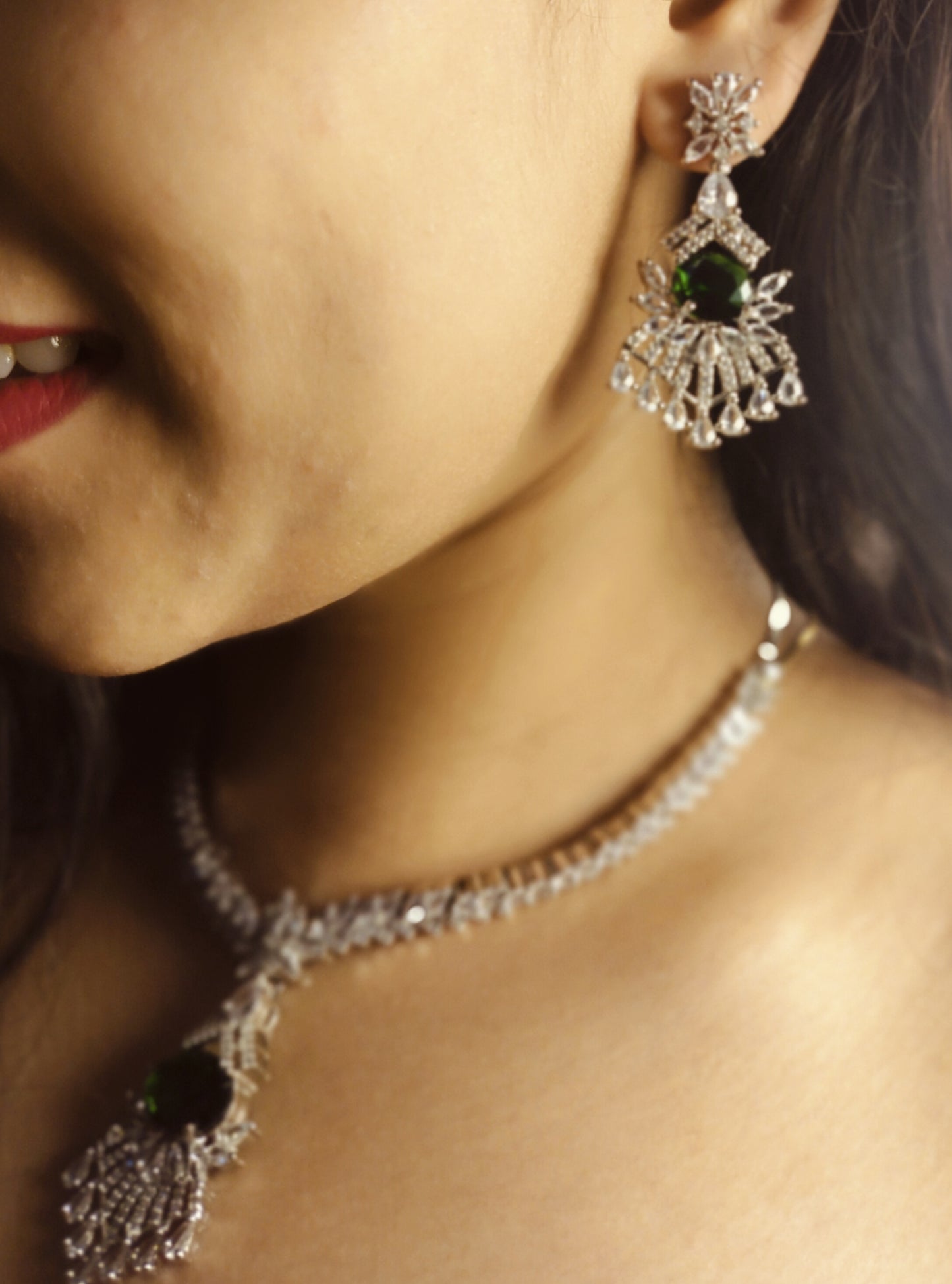 Green AD stone necklace and earring set by Wincham Fashion House worn on model