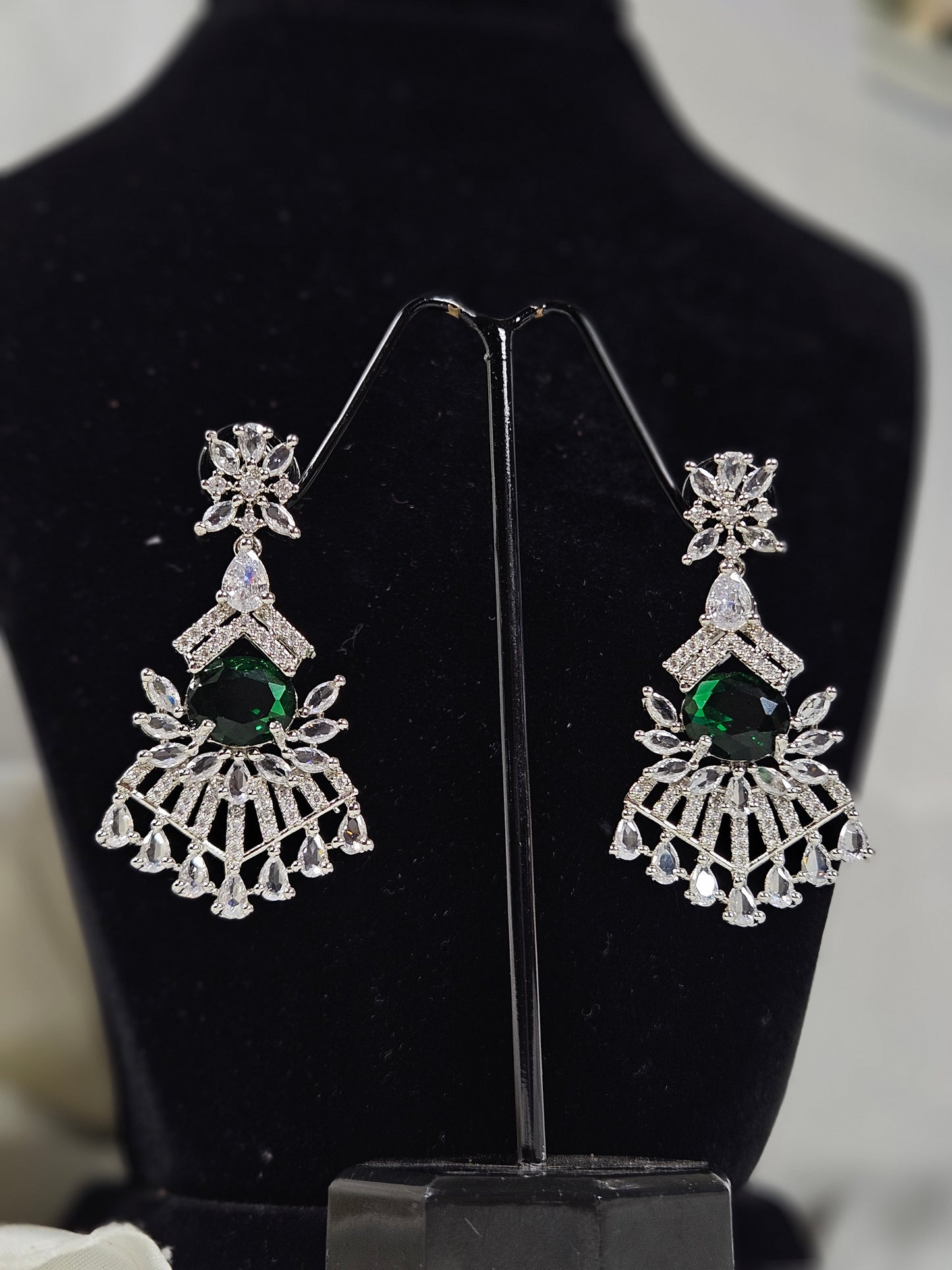 Wincham Fashion House green AD stone necklace and earring set featuring intricate silver design with green stones