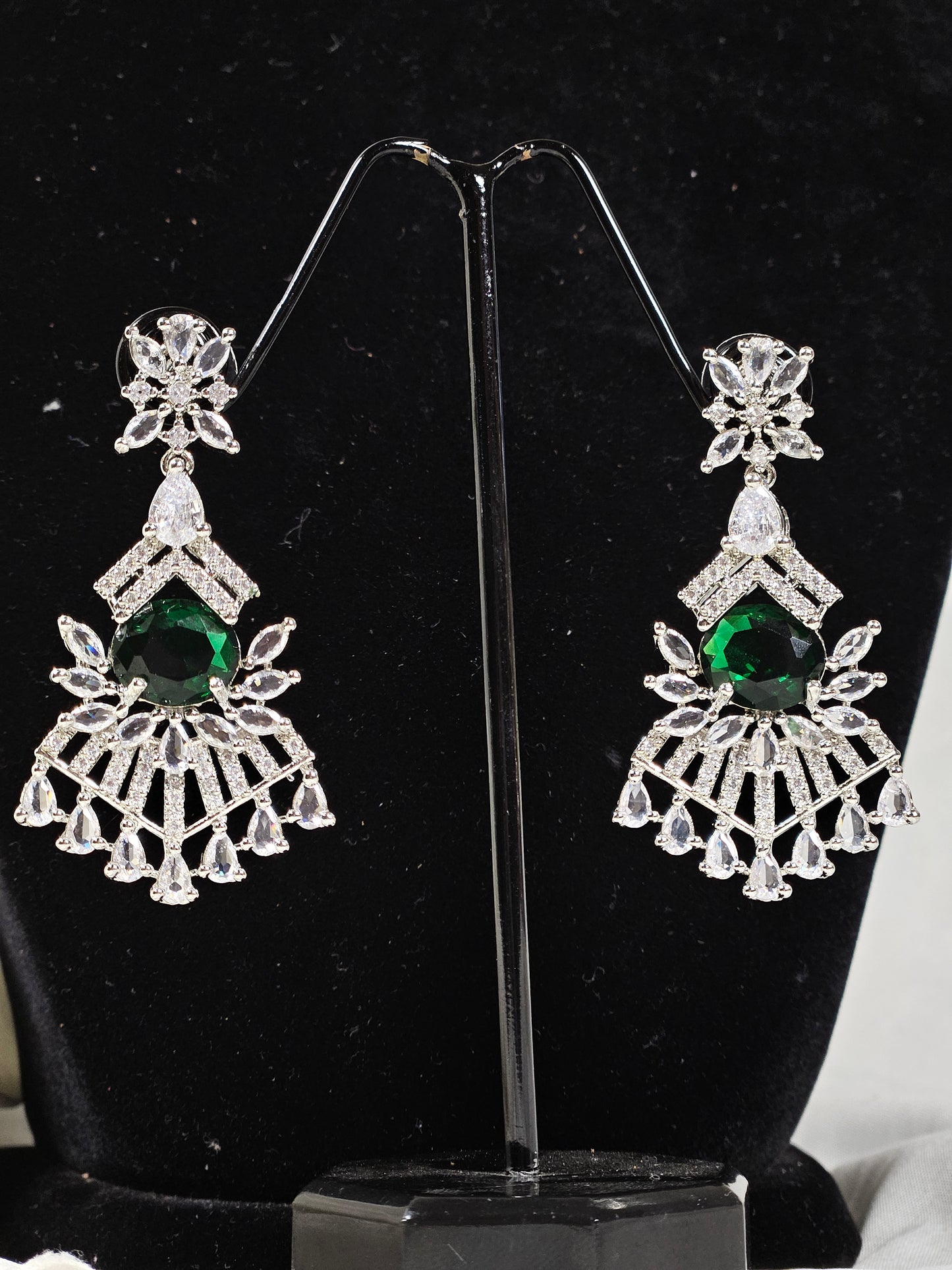 Green AD stone necklace and earring set featuring silver-tone intricate design with vibrant green stones and clear crystals