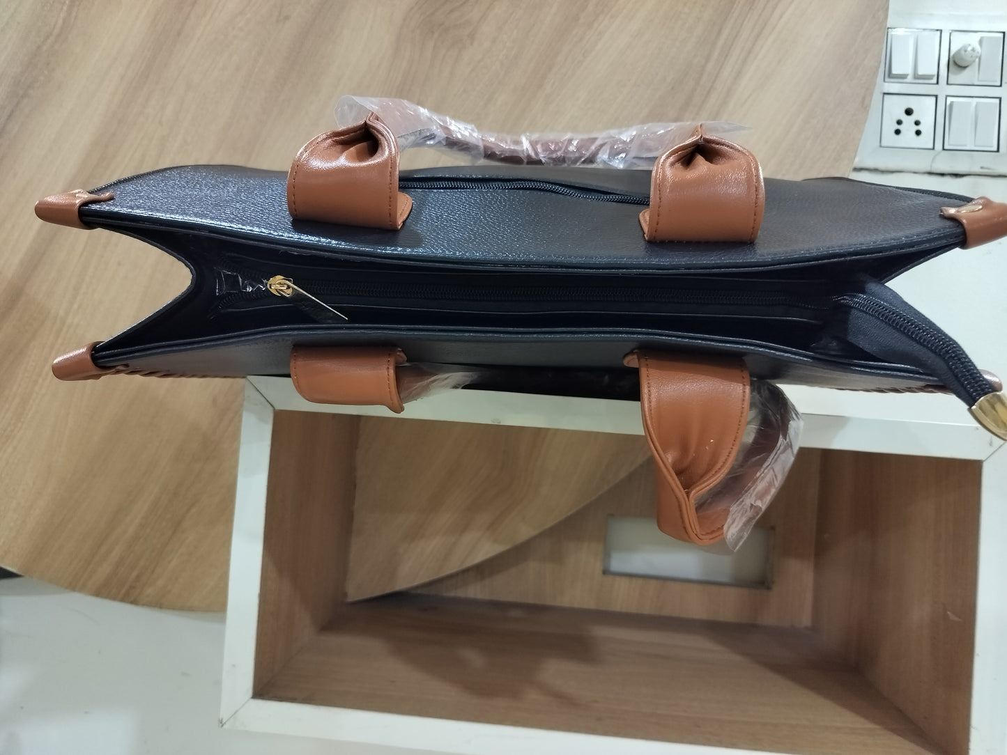 Wincham Fashion House handmade leather laptop tote in black and brown with top zipper and dual handles