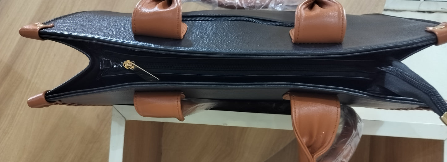Handmade leather laptop tote bag by Wincham Fashion House with black body and brown handles