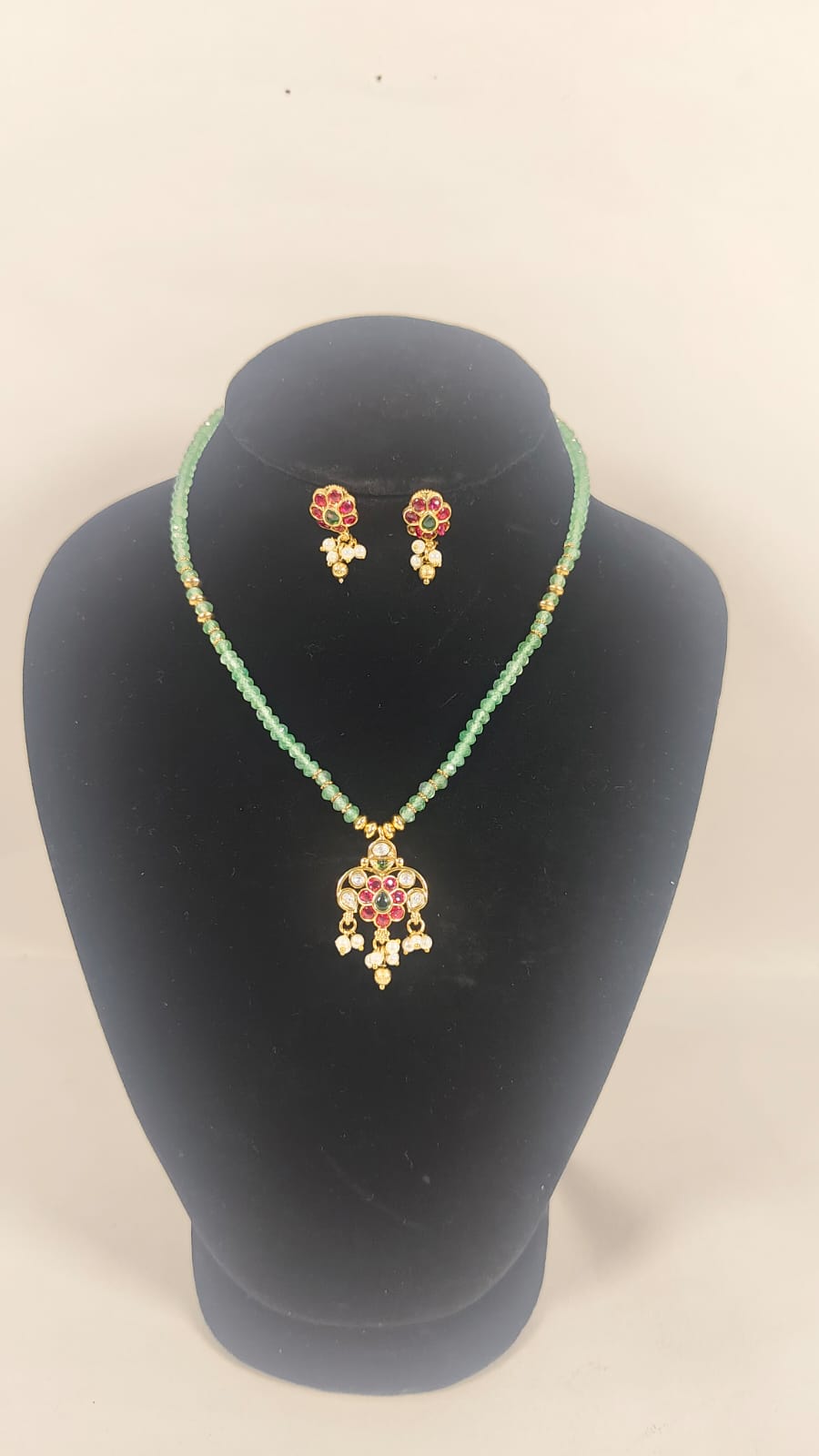 Wincham Fashion House jodhpuri necklace set with earrings in green and gold featuring intricate design