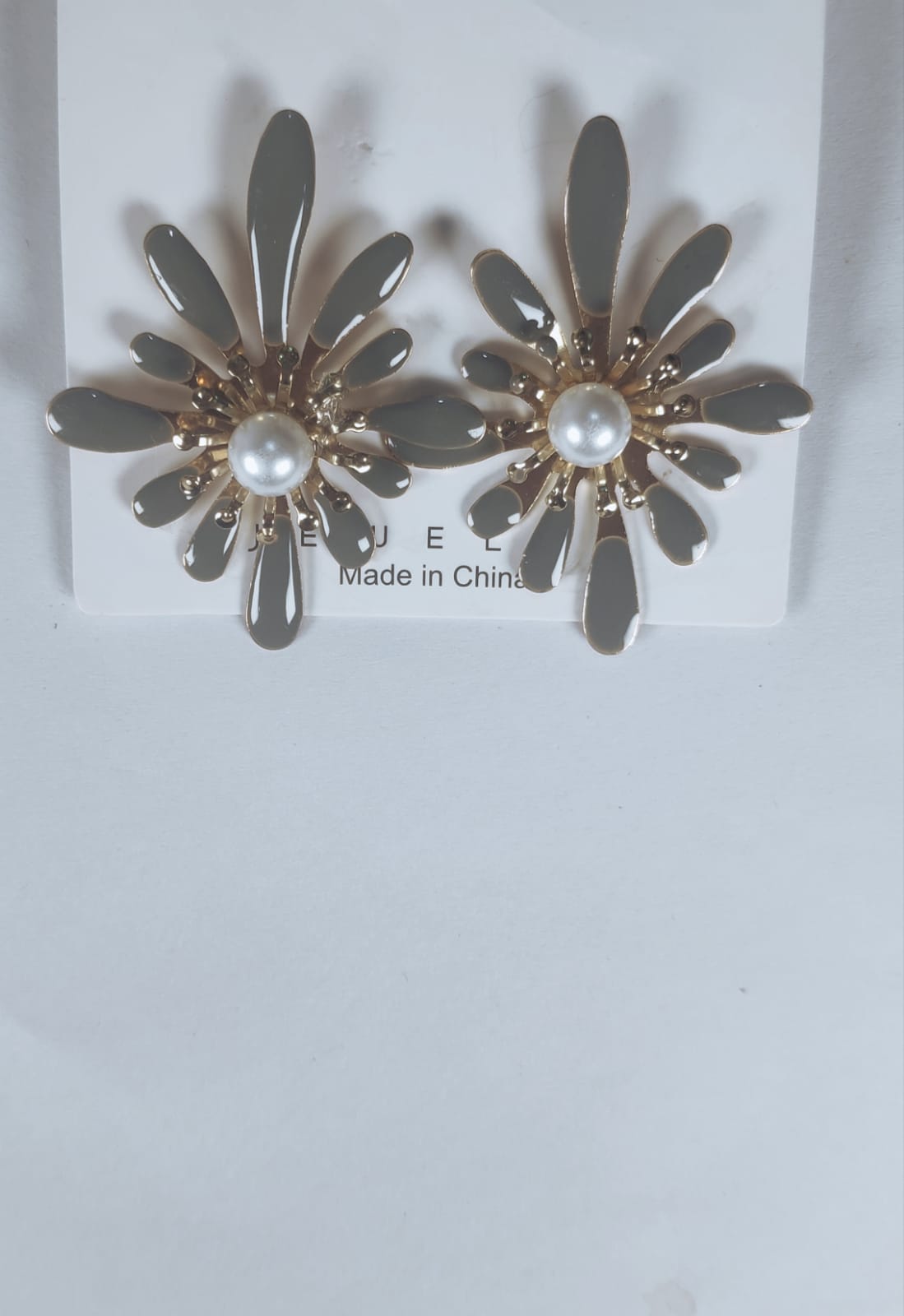 Gold-tone Korean flower earrings with pearl center on white display card