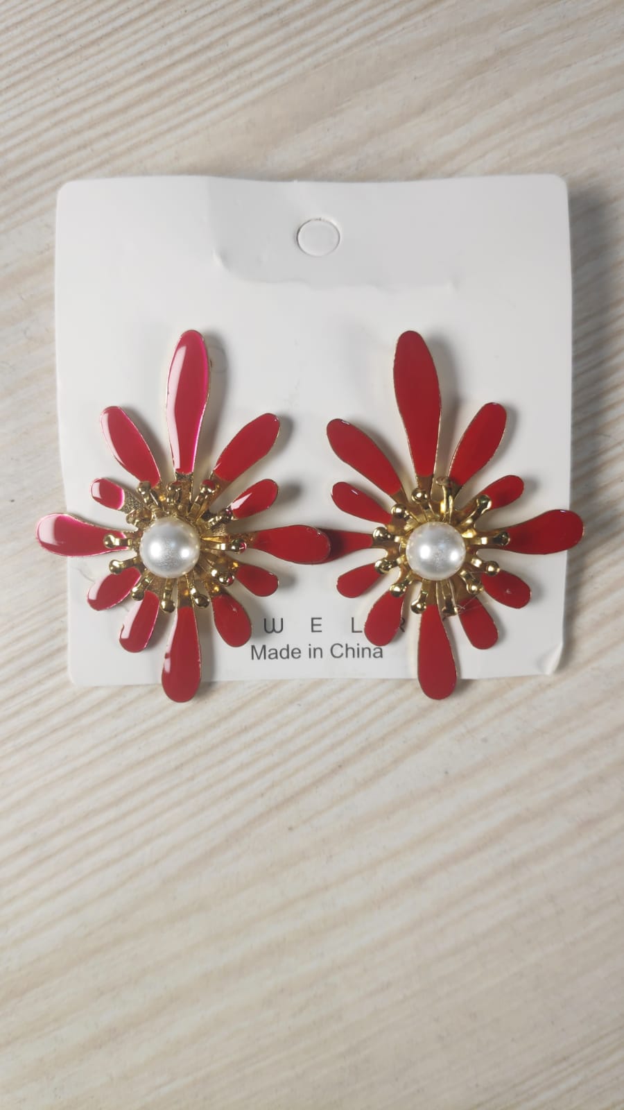 Red and gold Korean flower earrings with pearl center on white display card
