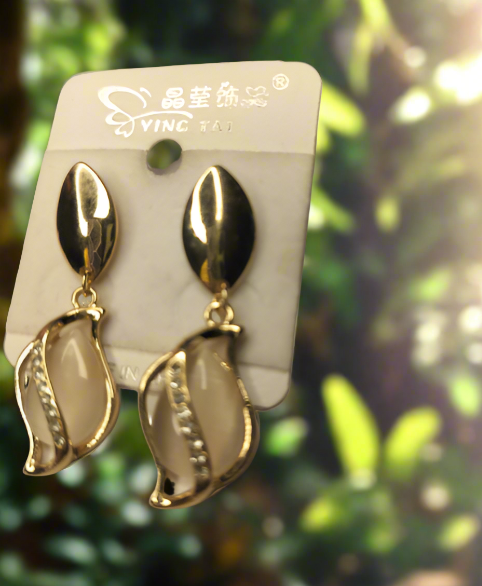 Elegant Korean gold earrings with a unique leaf-inspired design hanging