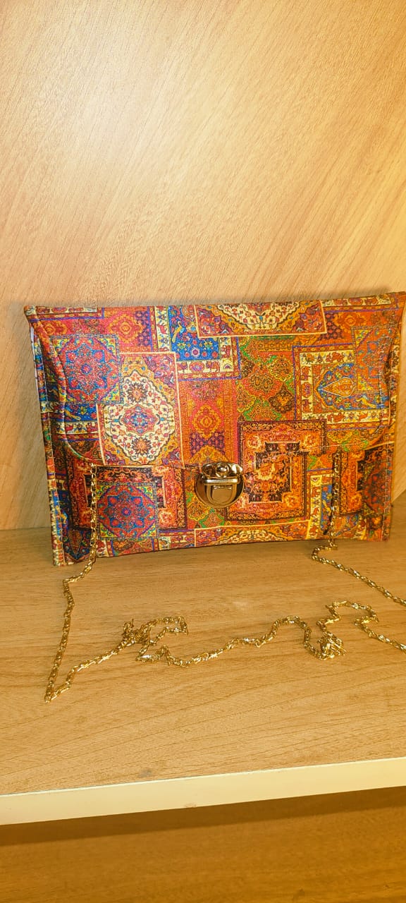 Wincham Fashion House multicolor hand purse with intricate pattern and gold chain strap