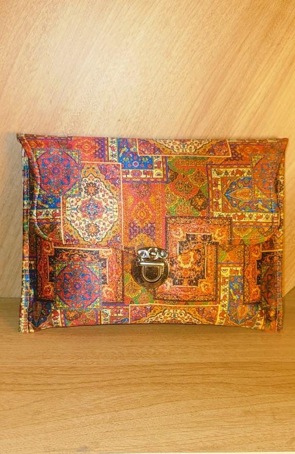 Wincham Fashion House multicolor hand purse with intricate geometric and floral patterns and metal clasp closure