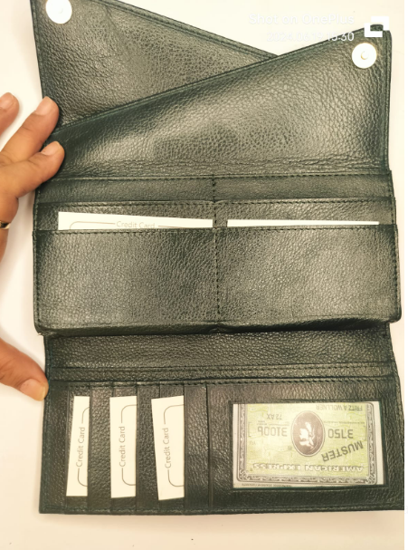 Open olive green leather wallet showing multiple card slots and clear ID window inside