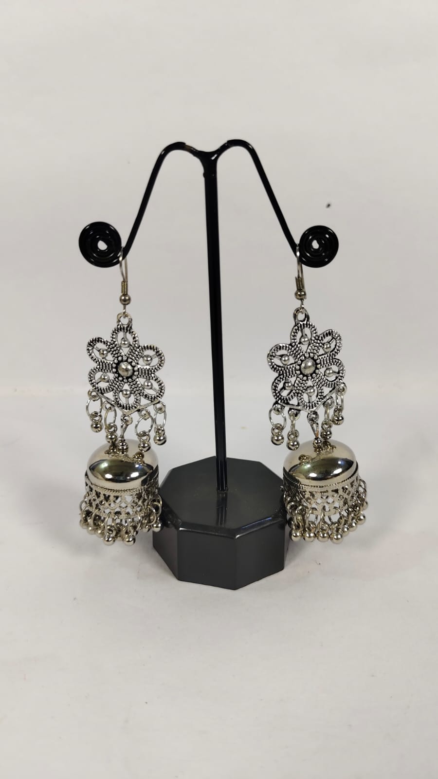 Oxidised silver dandiya jewellery earrings with intricate floral design and dangling embellishments