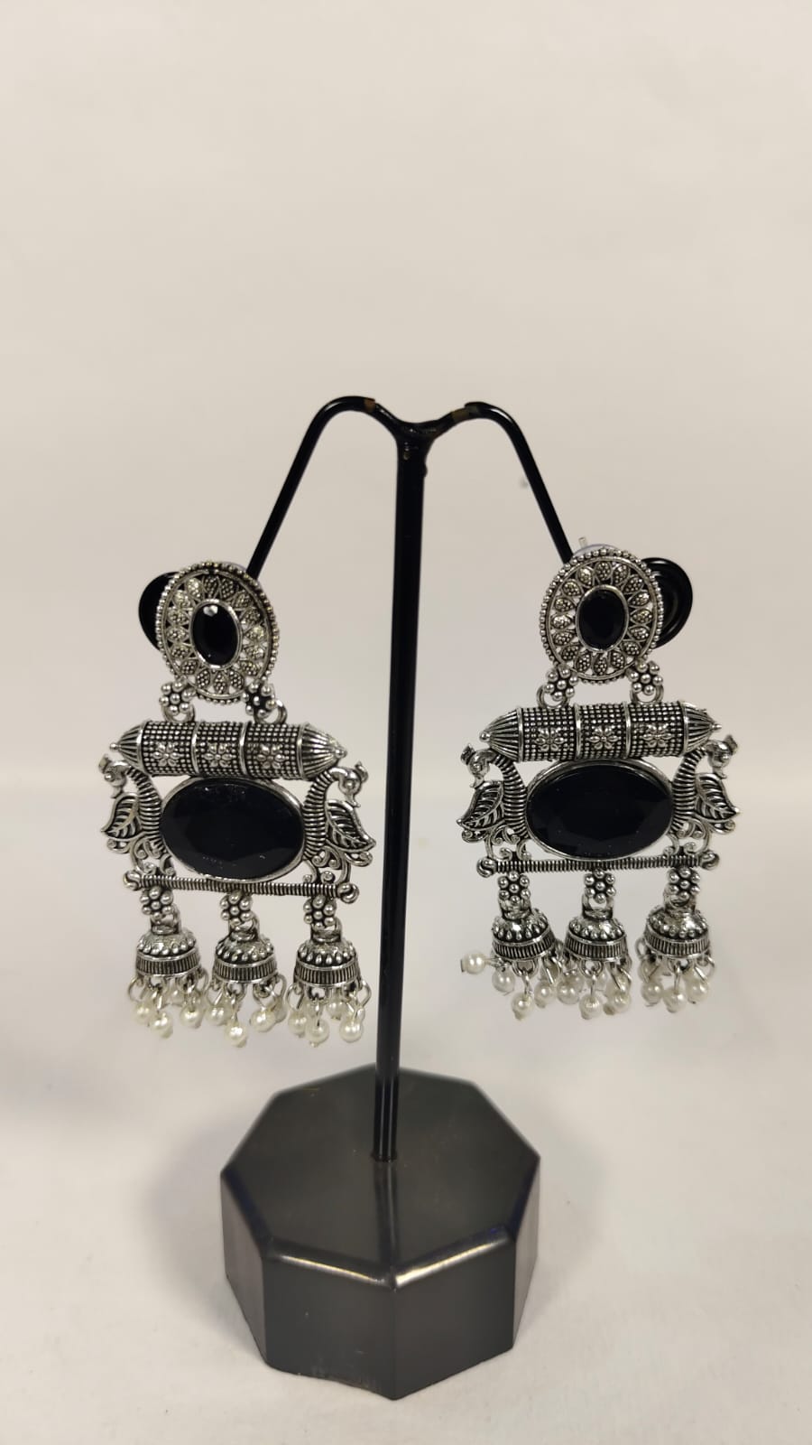 Oxidised silver dandiya jewellery earrings with intricate design and black stone details