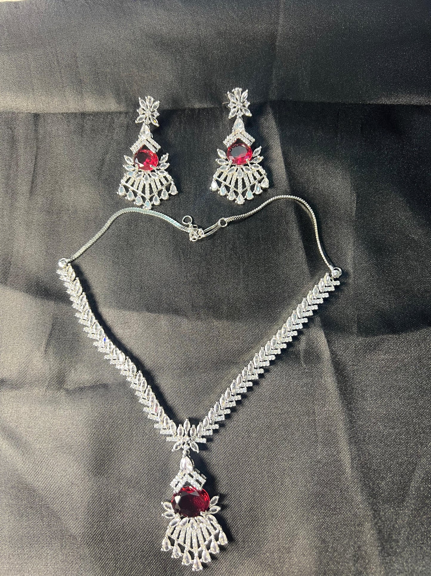 Peacock design ruby necklace AD set with matching earrings featuring red stones and intricate silver detailing