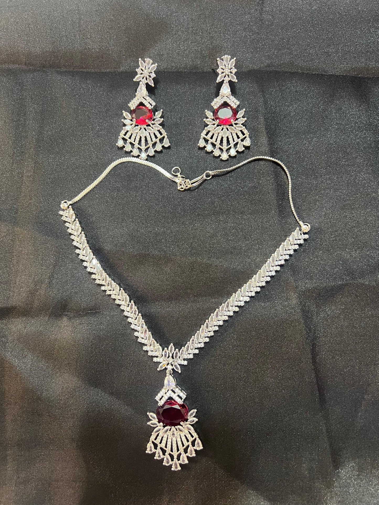 Peacock design ruby necklace AD set with matching earrings featuring intricate silver detailing