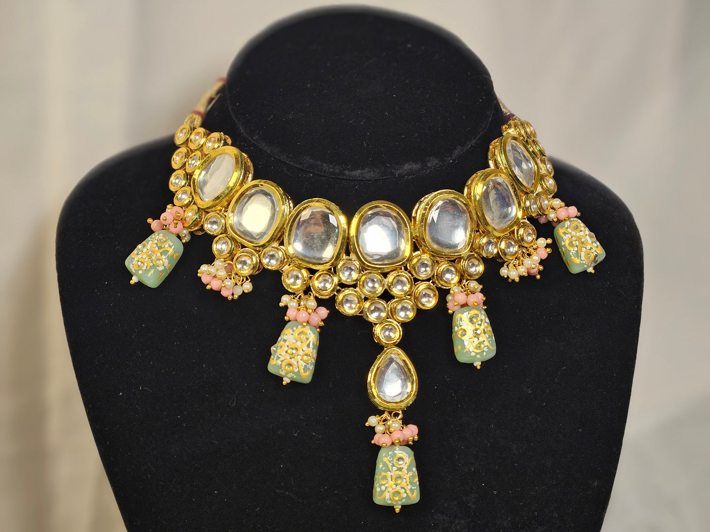 Pink and green Indian jewelry set necklace with gold and mirror embellishments by Wincham Fashion House