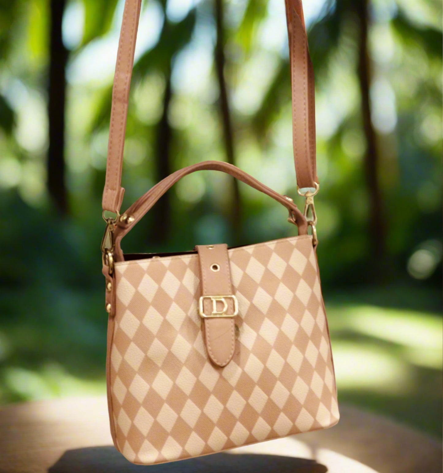 Pink leather purse for women with checkered pattern and adjustable shoulder strap