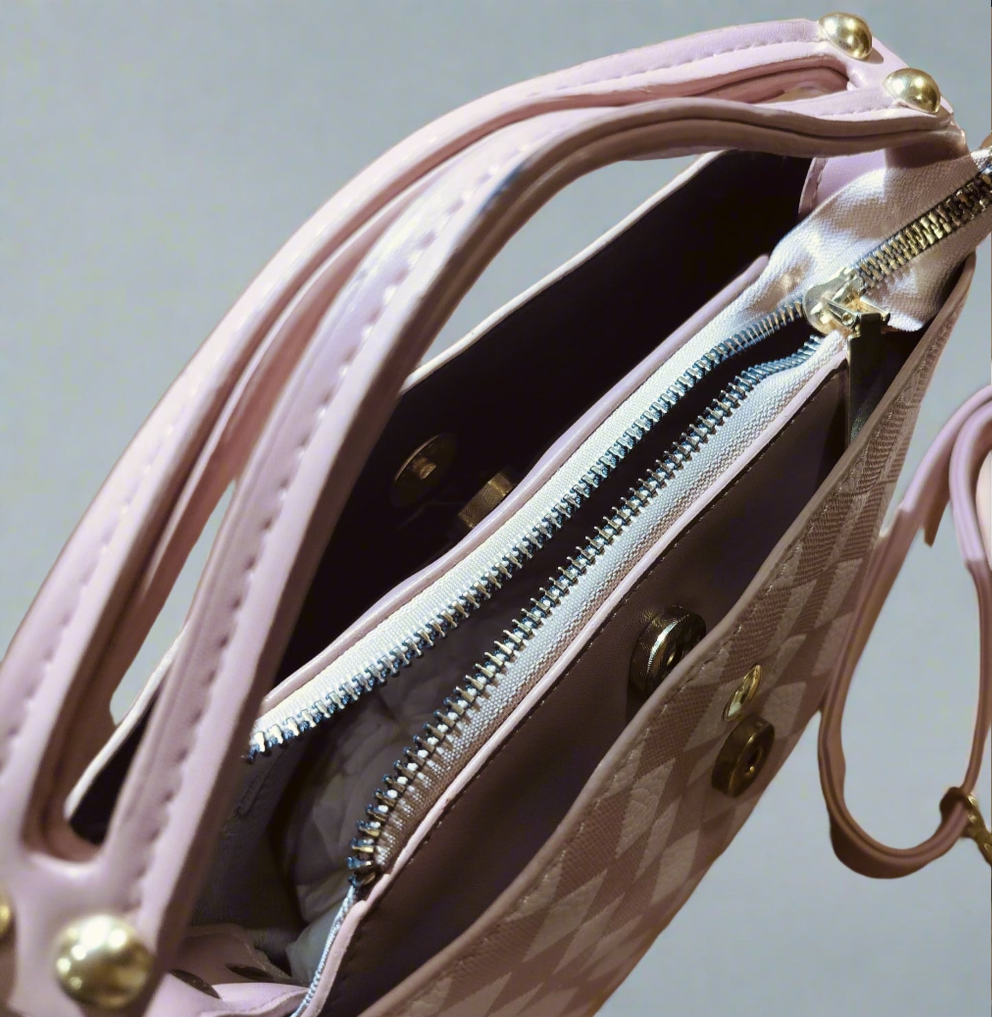 Close-up of pink leather purse for women with zipper and gold-tone hardware from My Store