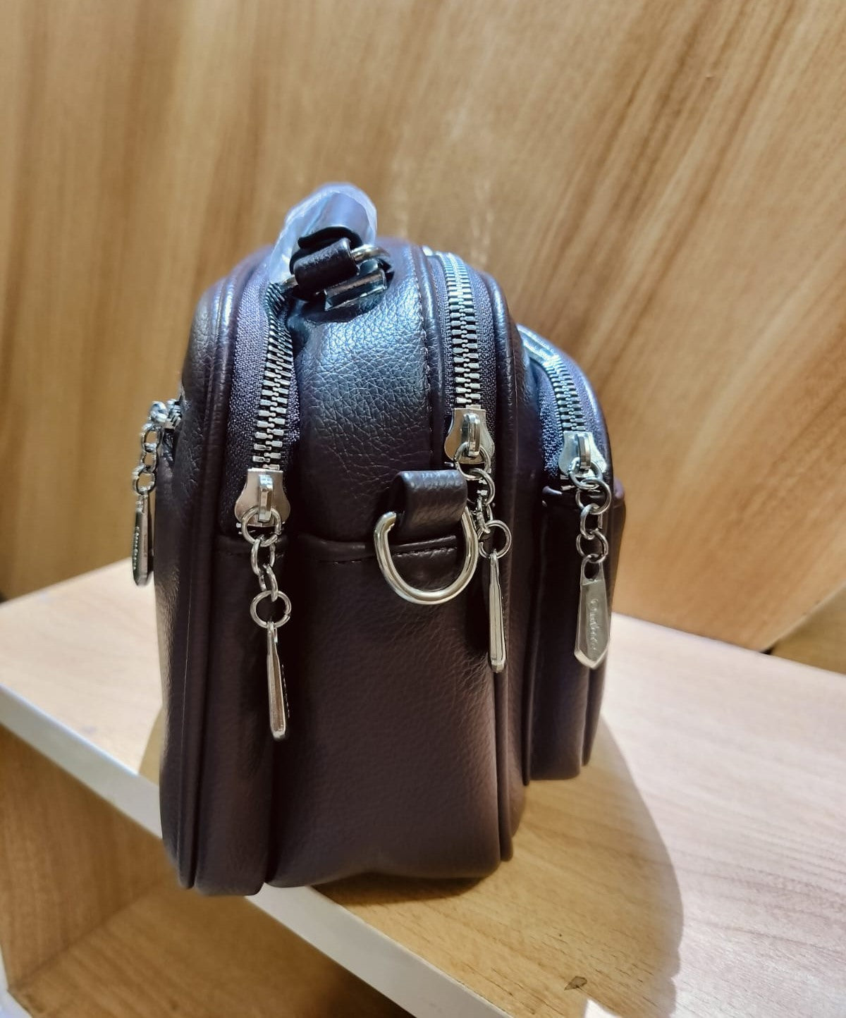 Wincham Fashion House black leather shoulder bag with multiple zippered compartments stylish navy blue shoulder bag