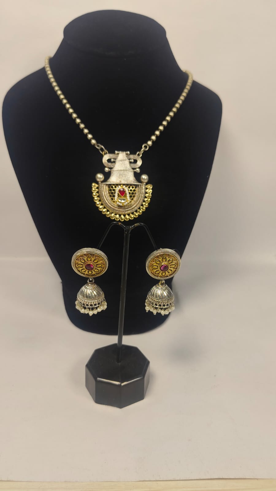 Temple necklace set with earrings featuring intricate design and colorful embellishments for a traditional look