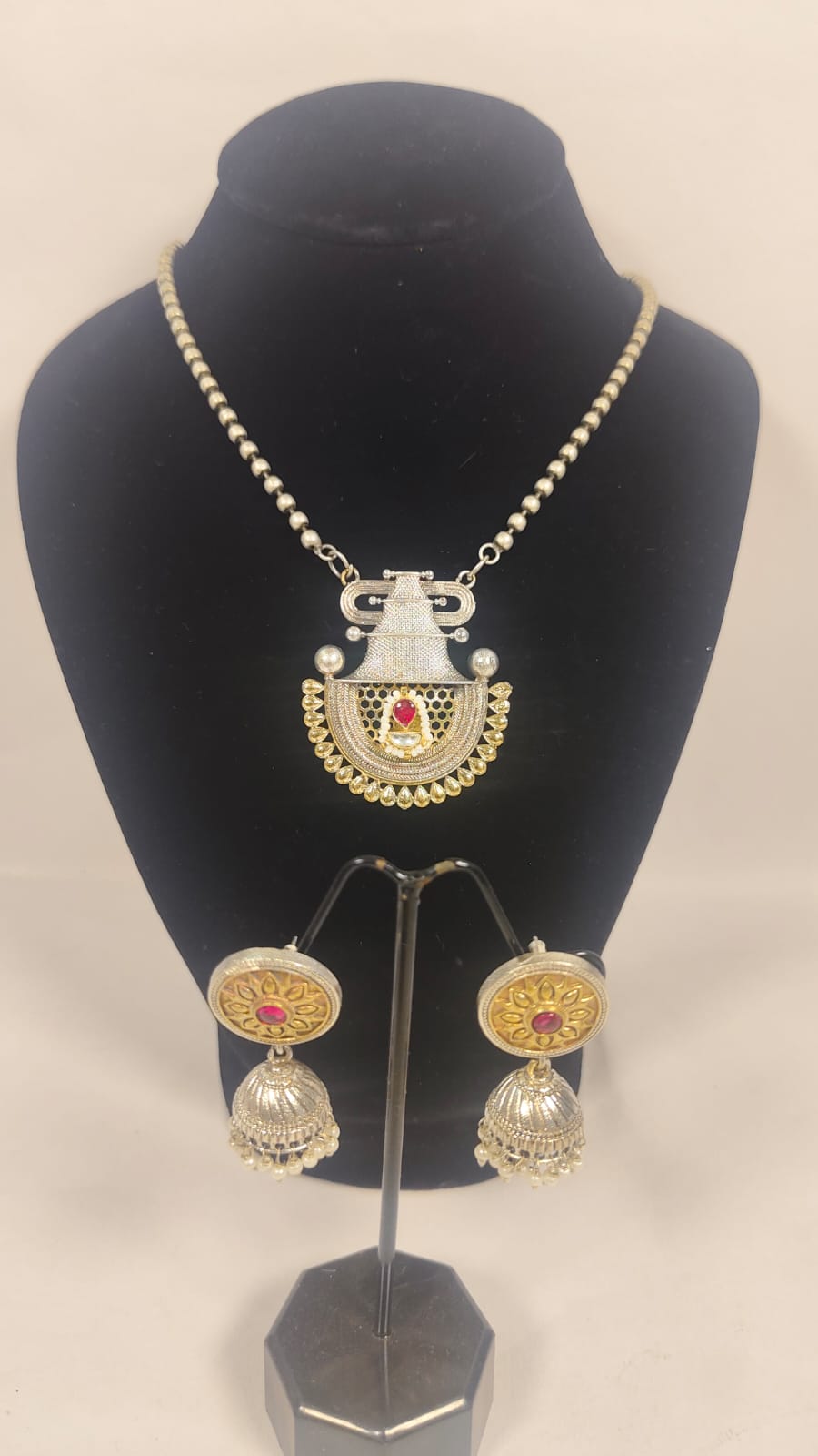 Temple necklace set with earrings featuring intricate design and traditional elements.