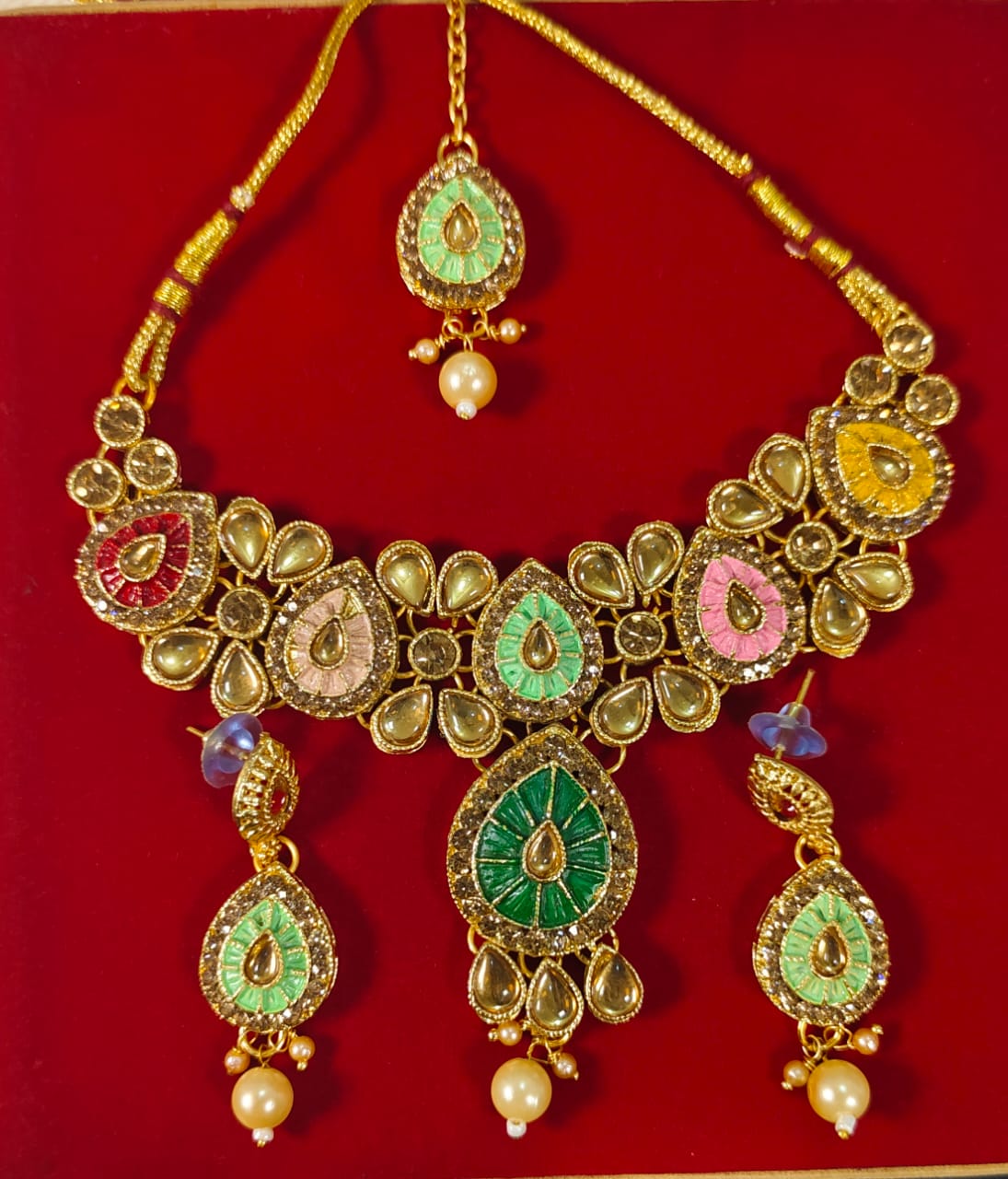 Wincham Fashion House traditional kundan jewelry set with multicolor stones and pearl accents on gold