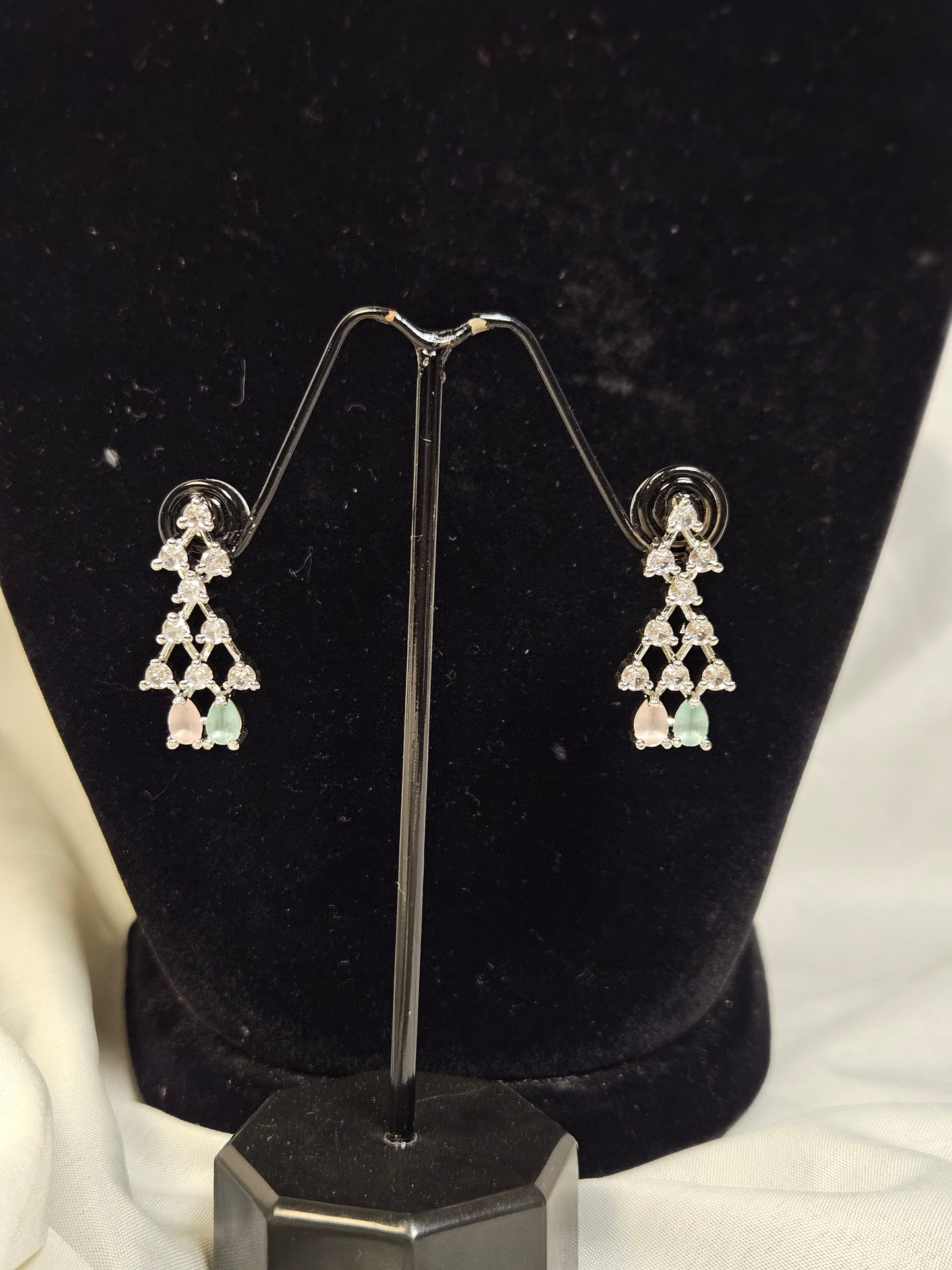 American diamond necklace set featuring elegant triangle-shaped earrings with pastel gemstone accents