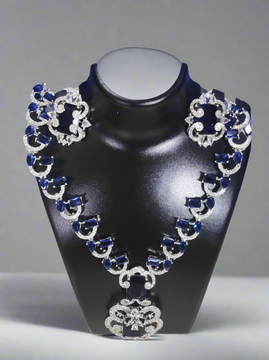 Elite royal blue design necklace set for weddings displayed on black jewelry stand by Wincham Fashion House