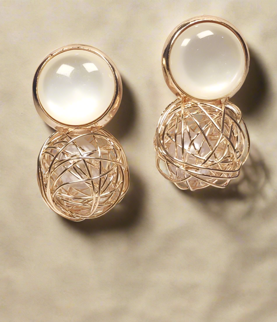 Korean pearl gold earrings by Wincham Fashion House with intricate wire design and smooth pearl accents