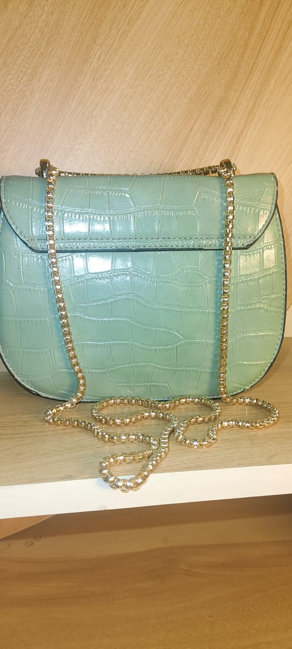 My Store white party sling purse with crocodile texture and gold chain strap on wooden shelf
