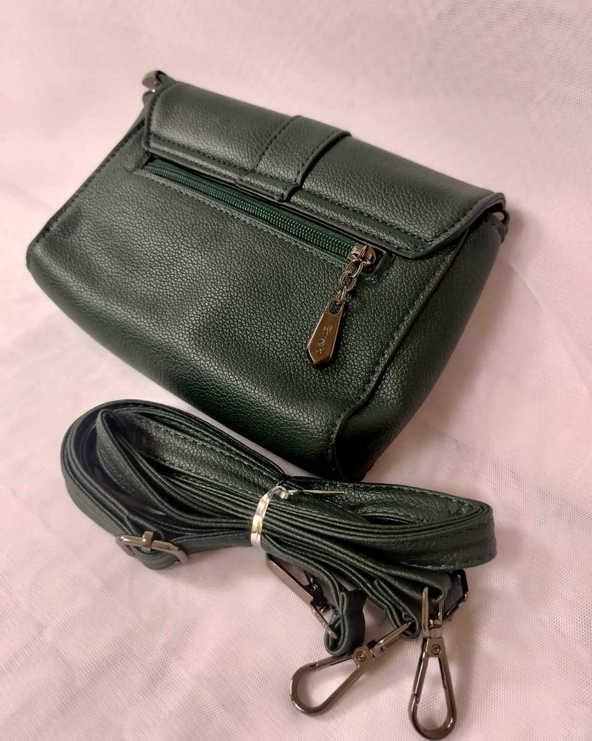 Dark green women's leather crossbody bag with zipper pocket and adjustable strap