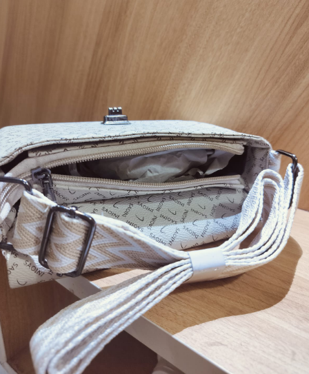 Open women's off white crossbody bag with belt showing interior and adjustable strap from My Store