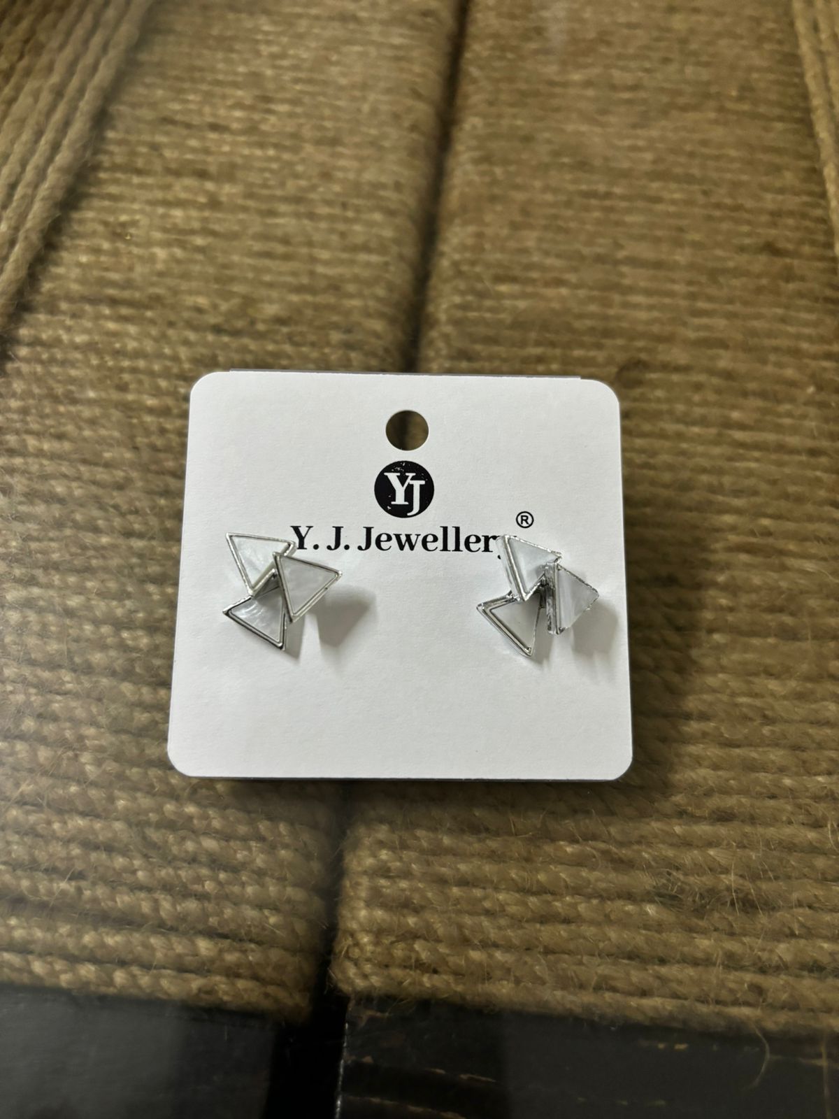 Wincham Fashion House Korean triangle silver earrings displayed on white card with YJ Jeweller logo