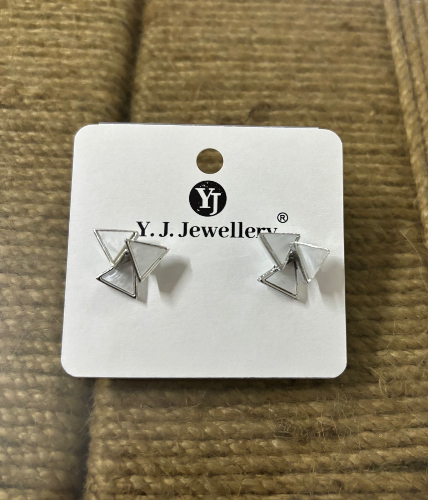 Korean triangle silver earrings by Wincham Fashion House on white Y.J. Jewellery card