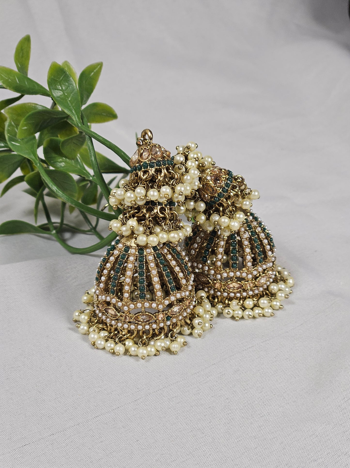 Wincham Fashion House American diamond jhumka earrings with polki adorned with pearls and intricate detailing