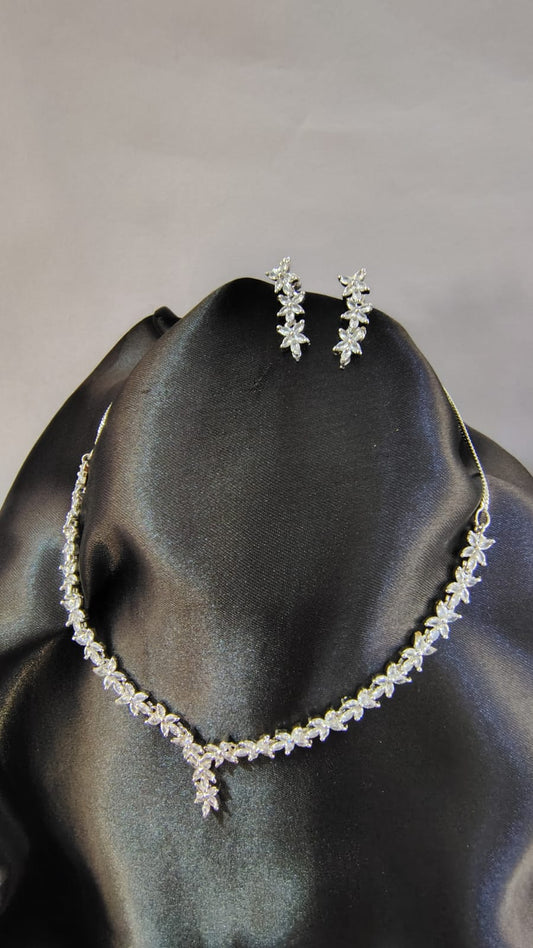 Wincham Fashion American Diamond leaf necklace set with matching earrings on black display