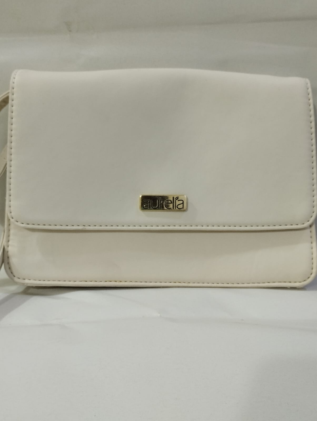 White Wincham Fashion House bag featuring a sleek design, ideal for stylish outfits, similar to Chanel handbags classic flap bag