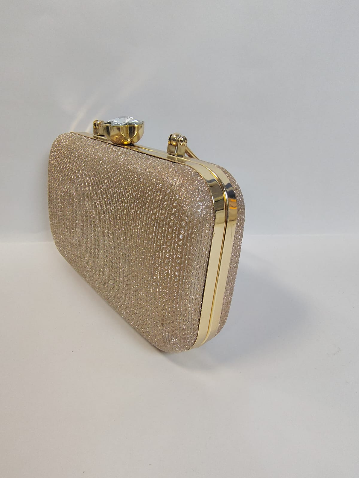 Elegant Wincham Fashion House clutch gold bag with a textured design and gold clasp closure