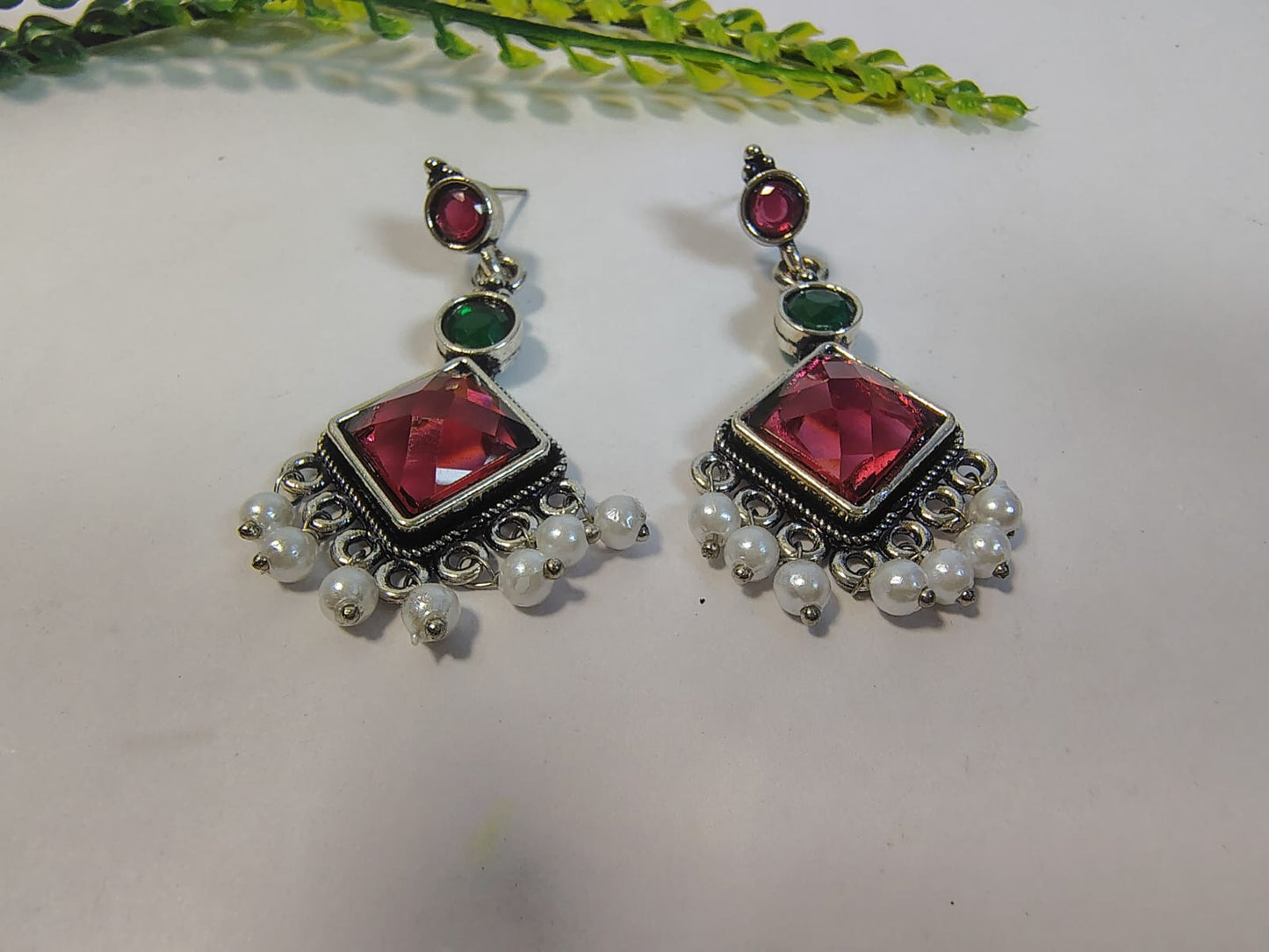 Elegant Dangle Earrings with Pearls featuring vibrant red and green gemstones for a stunning look