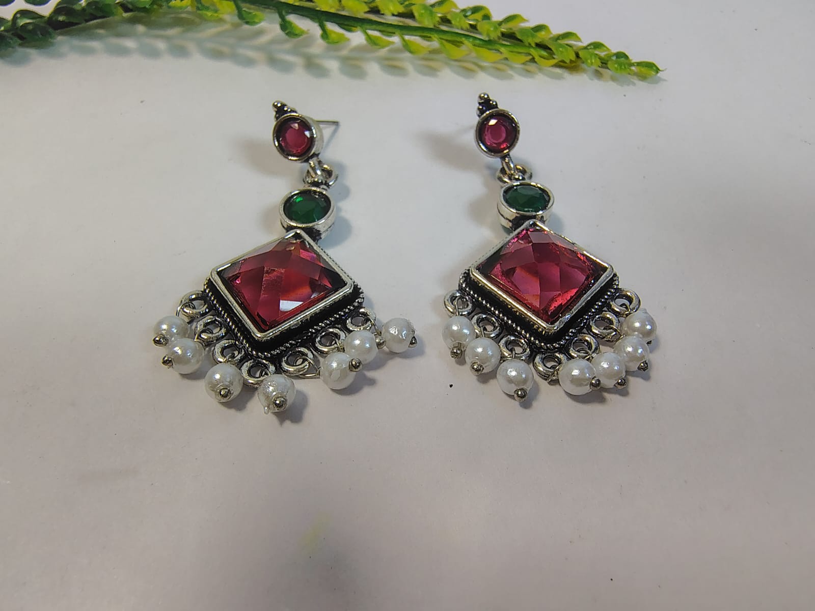 Elegant Dangle Earrings with Pearls featuring vibrant red and green gemstones for a stunning look