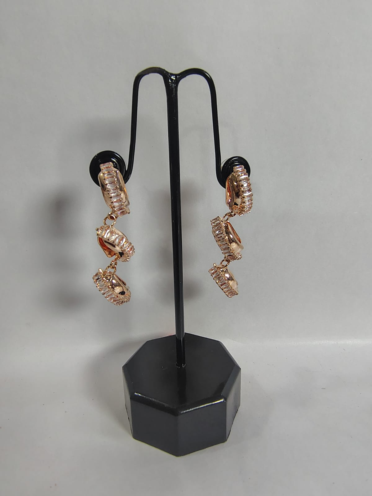 Elegant Wincham Fashion House drop earrings with a unique spiral design in rose gold