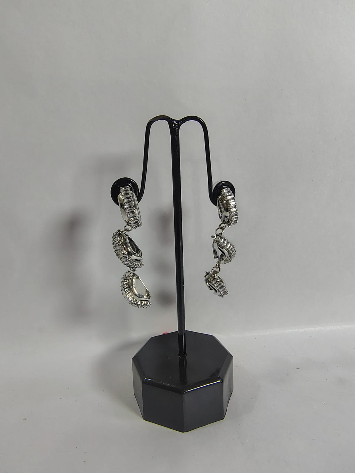 Stylish Wincham Fashion House drop earrings featuring intricate spiral design and shimmering details