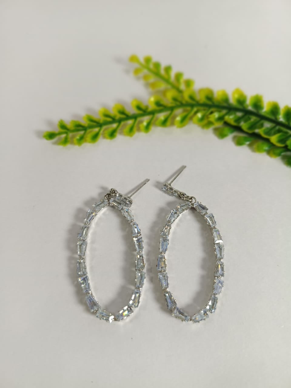 Elegant earrings sea glass in oval shape with shimmering accents for stylish jewelry lovers