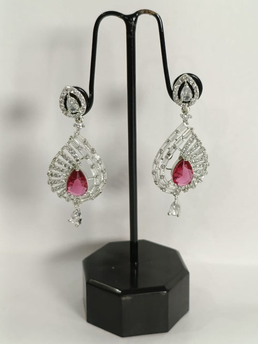 Elegant Wincham Fashion House earrings with ruby and sparkling diamonds in a teardrop design
