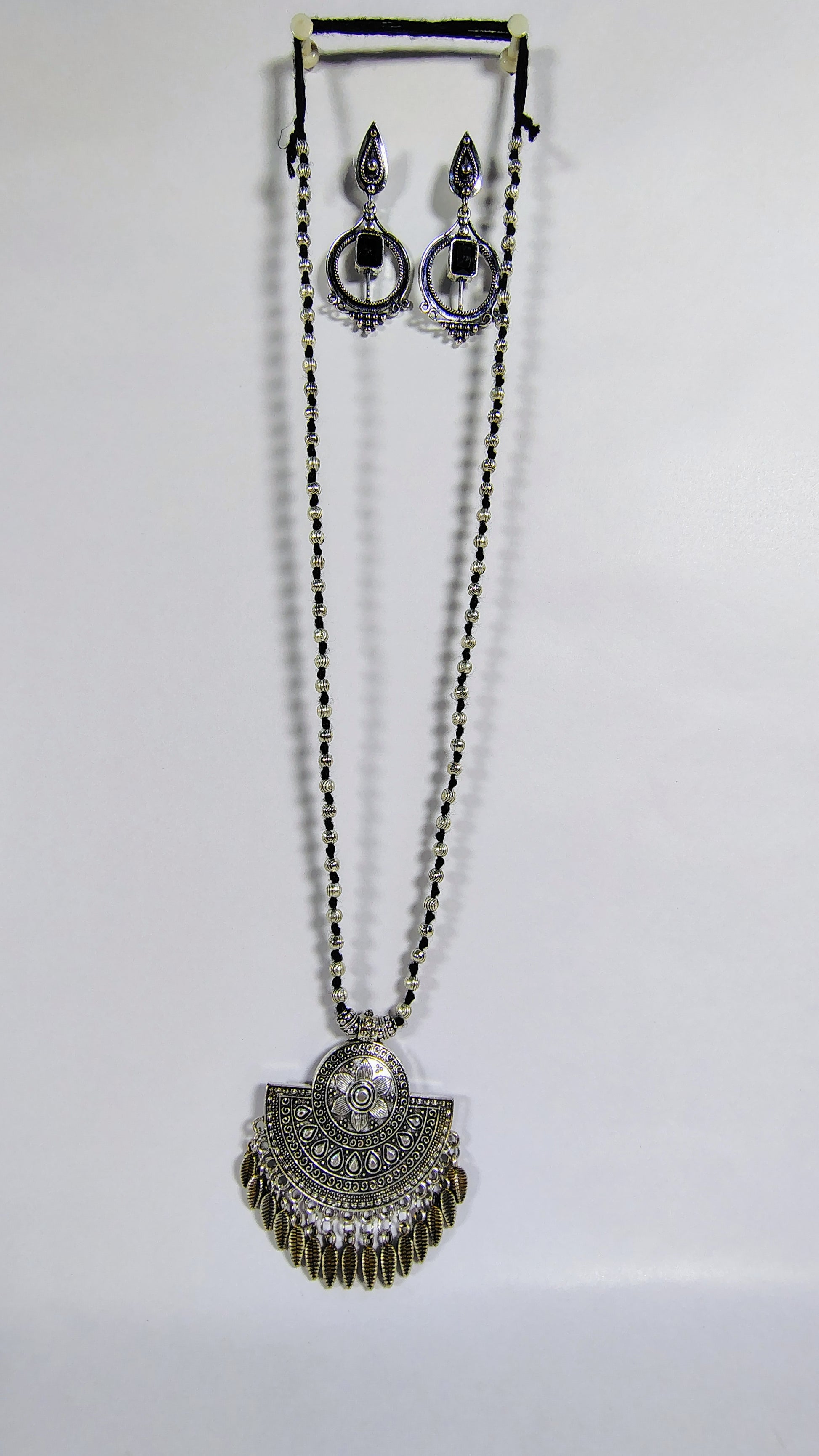  Ethnic statement necklace and earrings set with intricate silver detailing