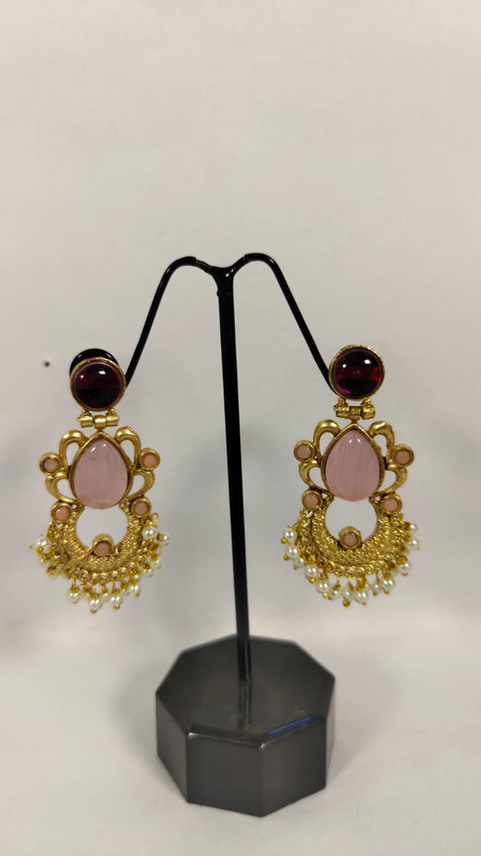 Fancy party wear earrings with pink stones and gold detailing, perfect for elegant occasions